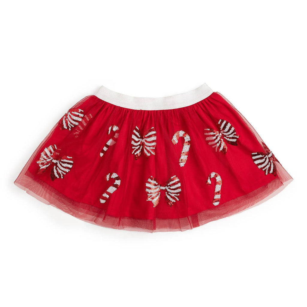 Red skirt with candy cane and bow patterns on a white background