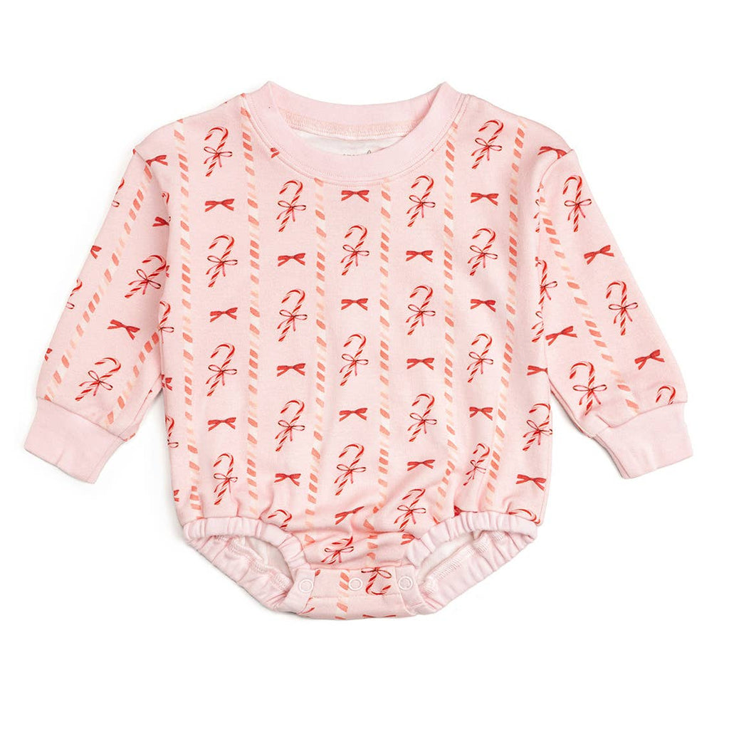 Pink baby onesie with candy cane and bow pattern on a white background