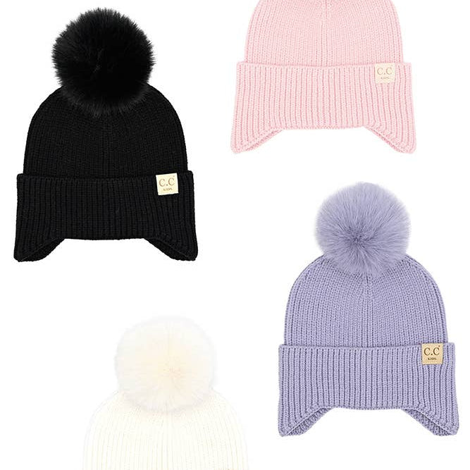 Three beanies in black, pink, and purple with pom-poms on a white background.