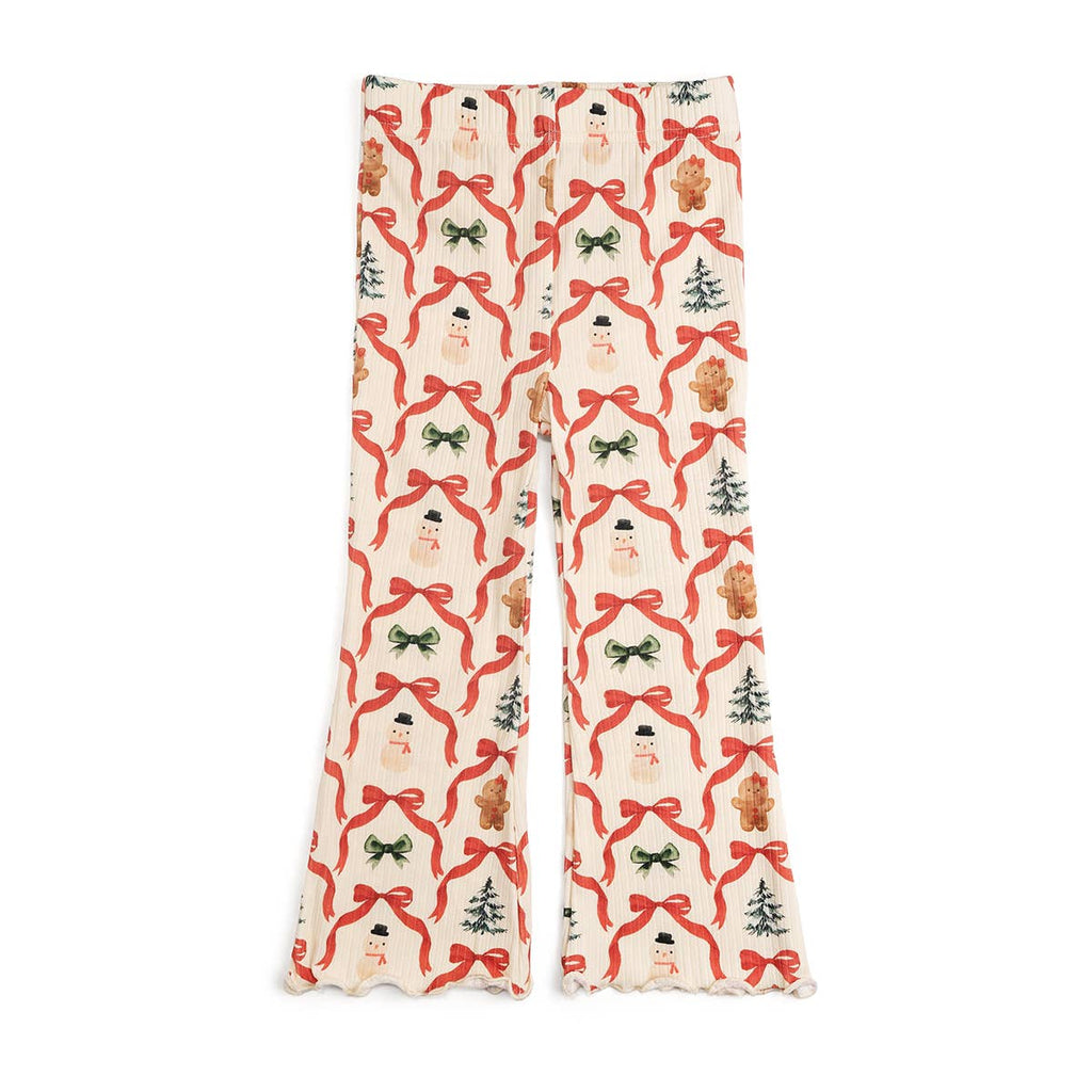 Pajama pants with a festive pattern featuring Santa Claus, reindeer, and Christmas trees on a white background.