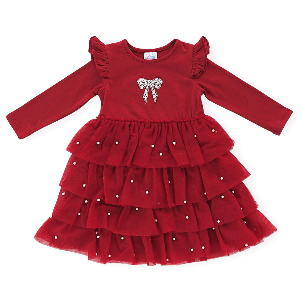 Red dress with a bow design on a white background