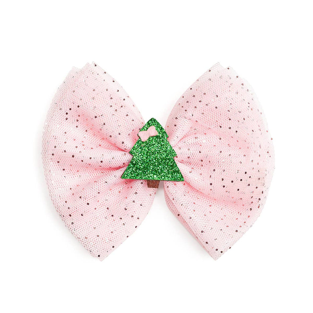 Pink bow hair clip with a green glittery center on a white background