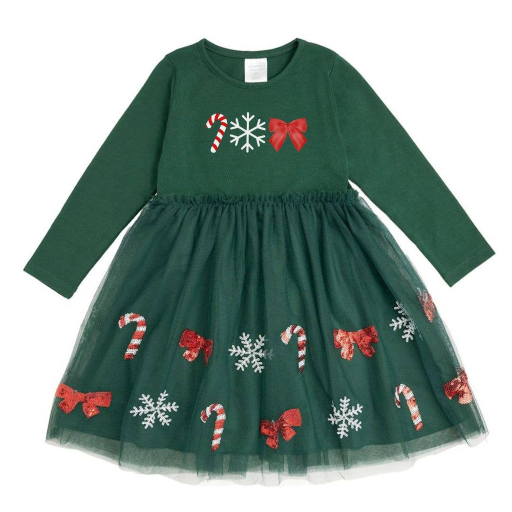 Green dress with Christmas-themed patterns on a white background