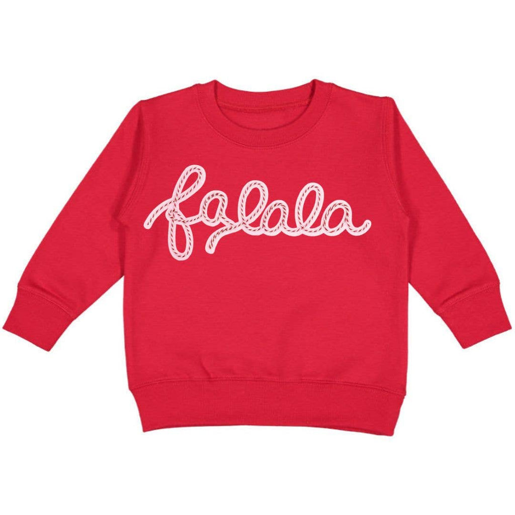 Red sweatshirt with 'fa la la' text on a white background