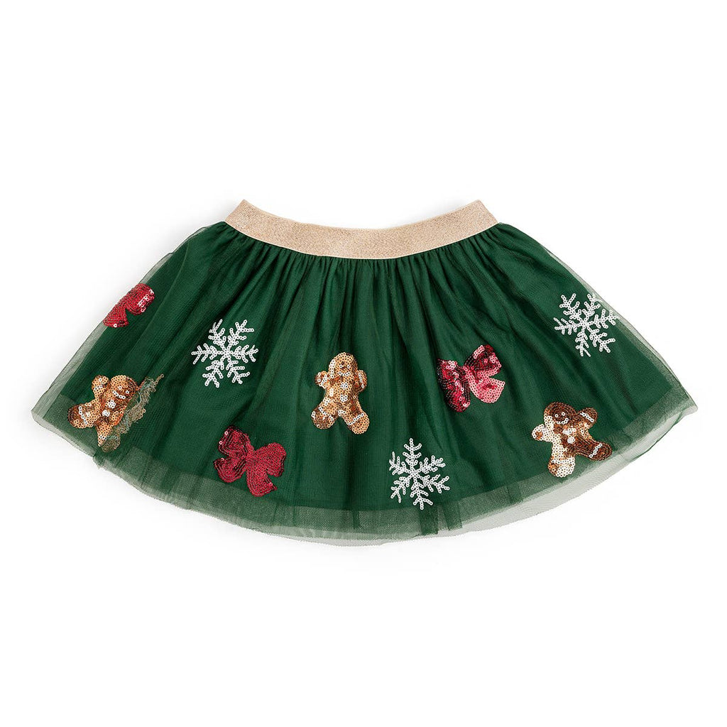 Green tutu skirt with gingerbread men, snowflakes, and red bows on a white background