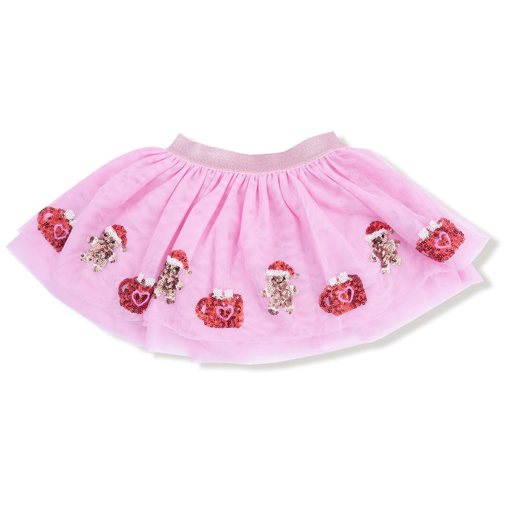 Pink tutu skirt with embroidered designs on a white background