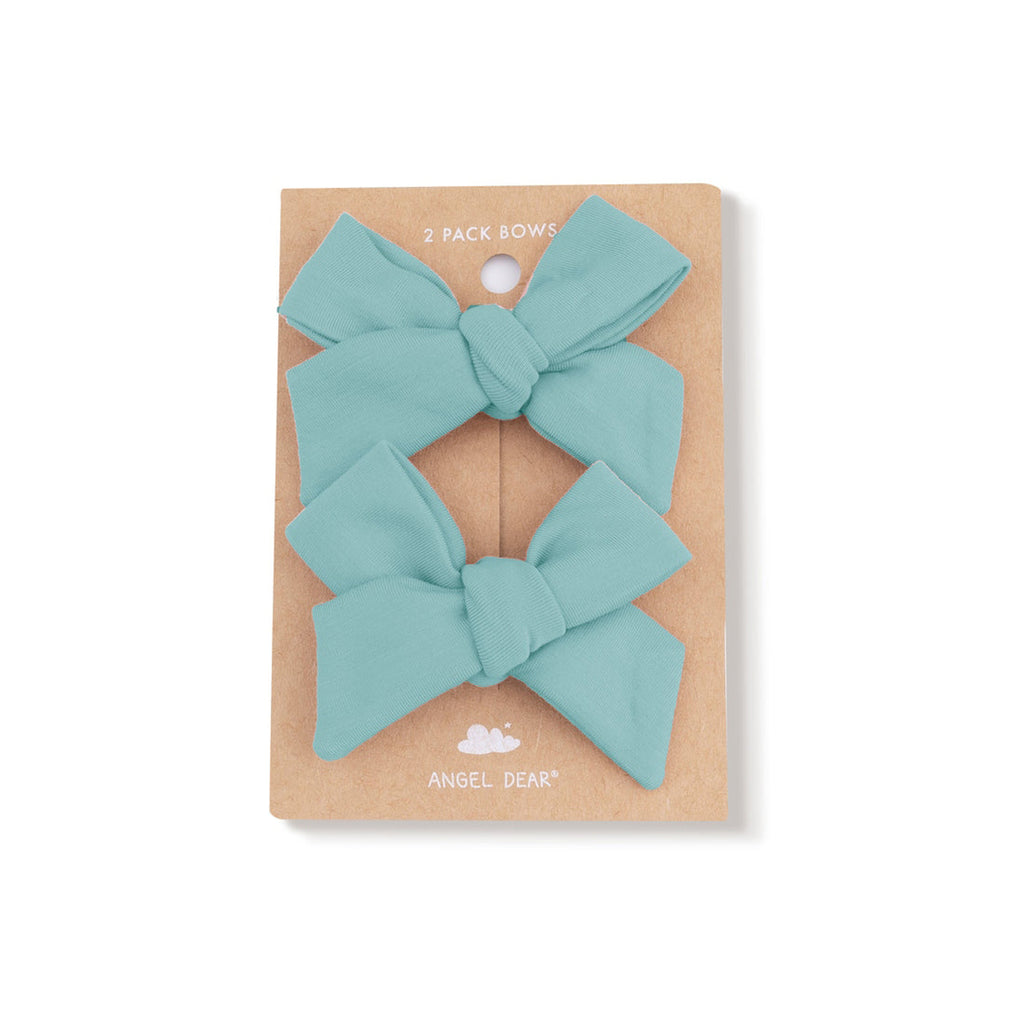 Two teal bows in a cardboard packaging with 'Angel Dear' branding on a white background.