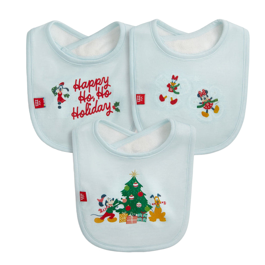 Three Christmas-themed baby bibs with festive designs on a white background