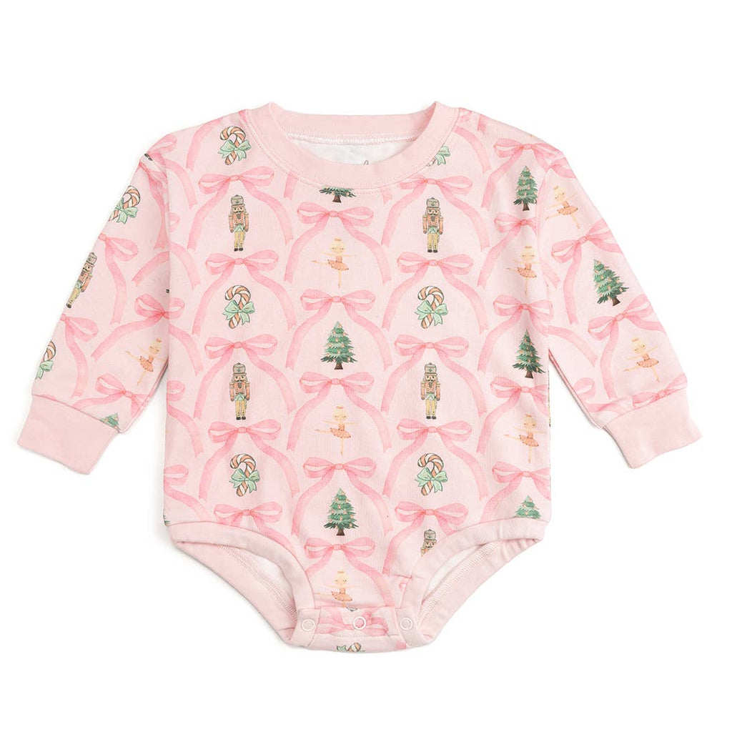 Pink baby onesie with festive pattern on a white background