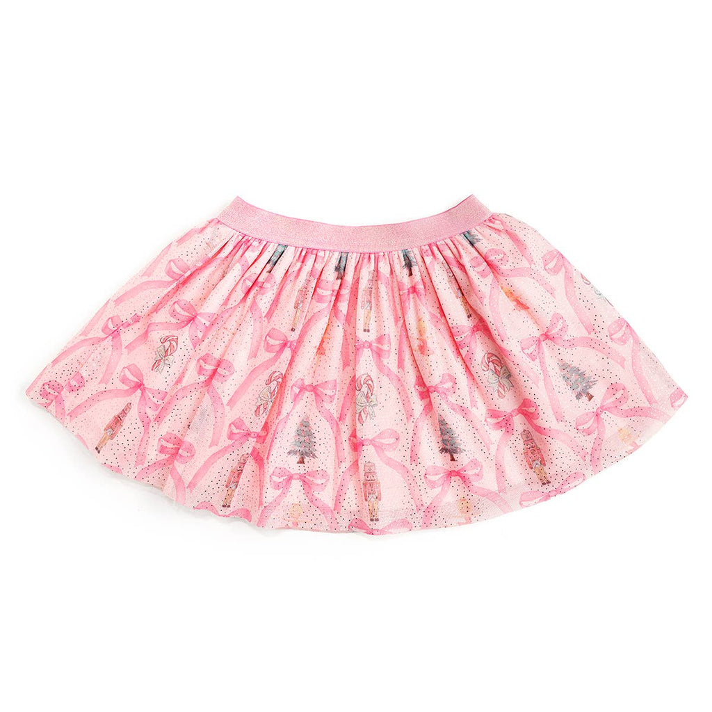 Pink skirt with bow and tree pattern on a white background
