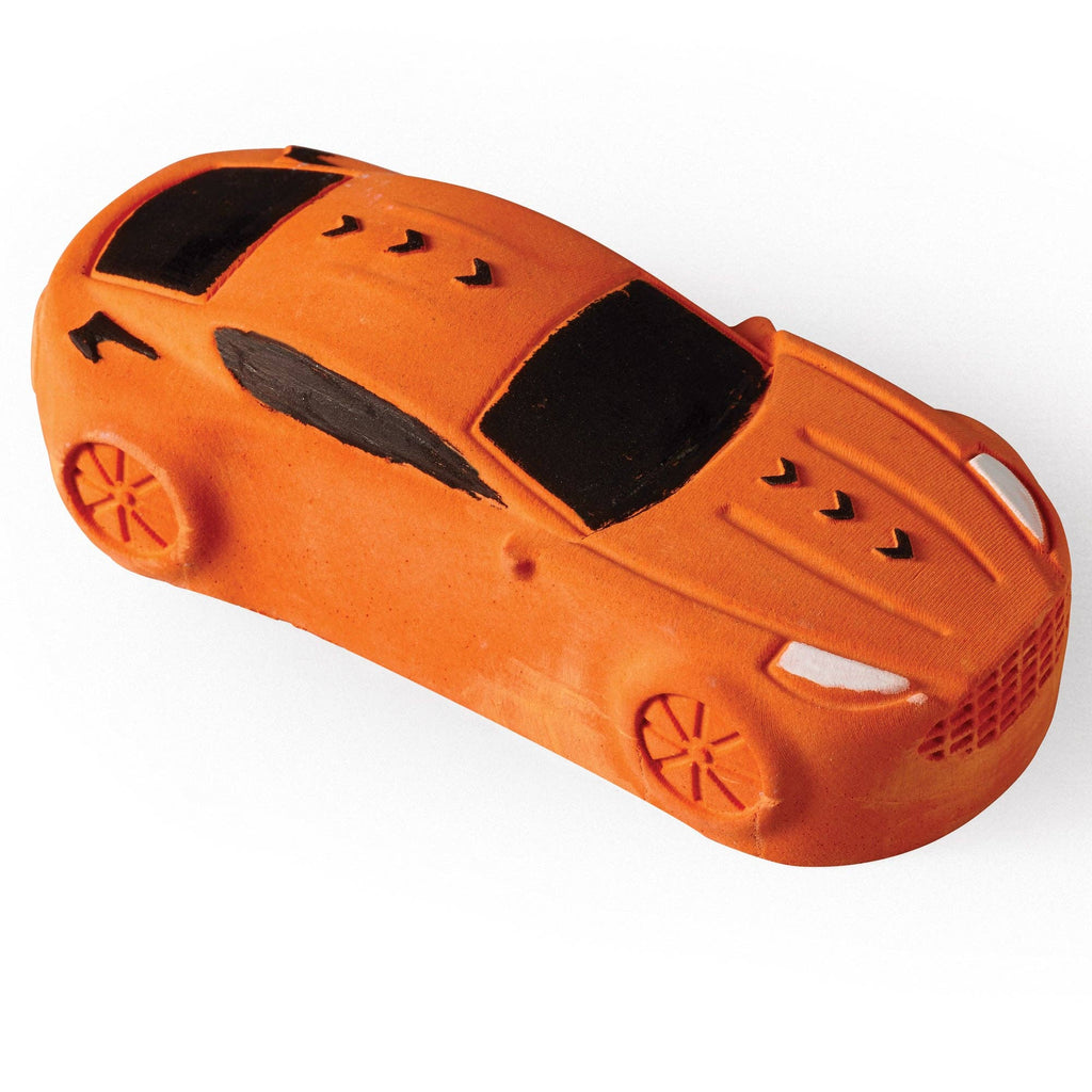 Orange toy car on a white background